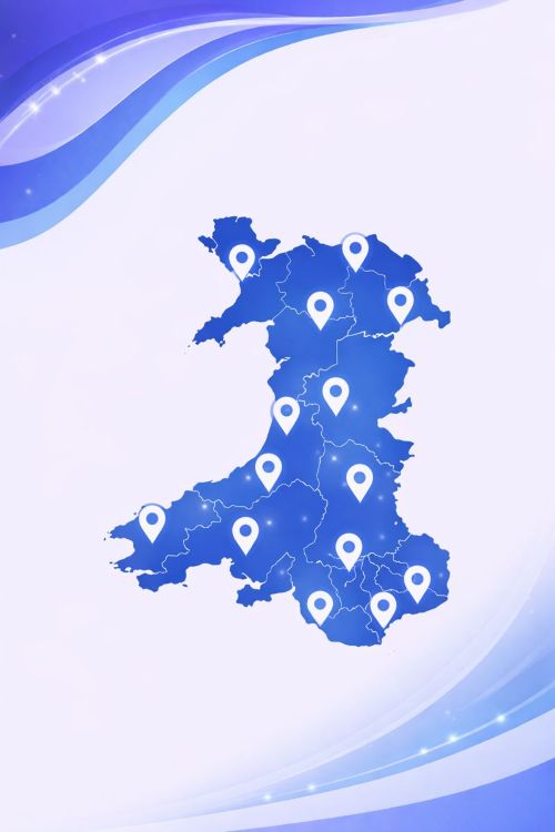 Vector map of Wales displayed in light and dark blue branding colours, showing the country outline with internal region boundaries and multiple location pin icons placed across Wales to represent service coverage areas.