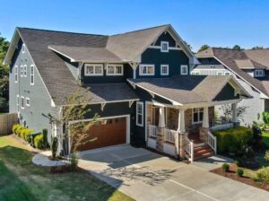 Detached family house with driveway, garage, and landscaped garden, representing a property purchase funded through an overseas mortgage for buyers investing or relocating abroad.