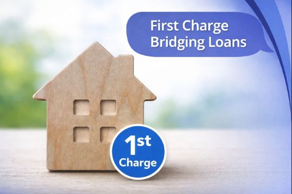 A branded graphic showing a wooden house-shaped cutout with four square windows on a softly blurred, light background. A red circular badge near the bottom reads “1st Charge”. In the top-right, a blue speech-bubble banner (with curved blue brand arcs along the right edge) contains the title “First Charge Bridging Loans” in white Open Sans.